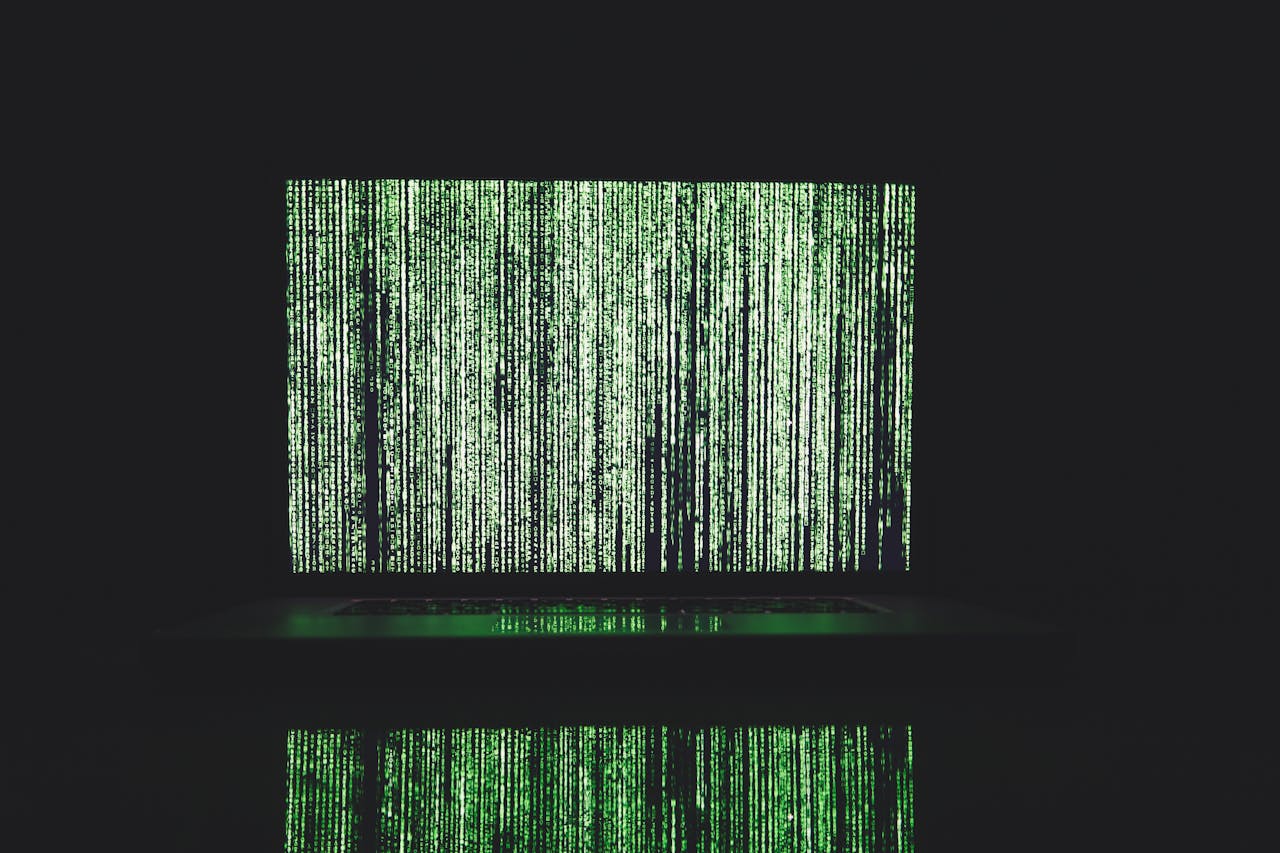 Abstract depiction of green matrix code on a computer monitor.