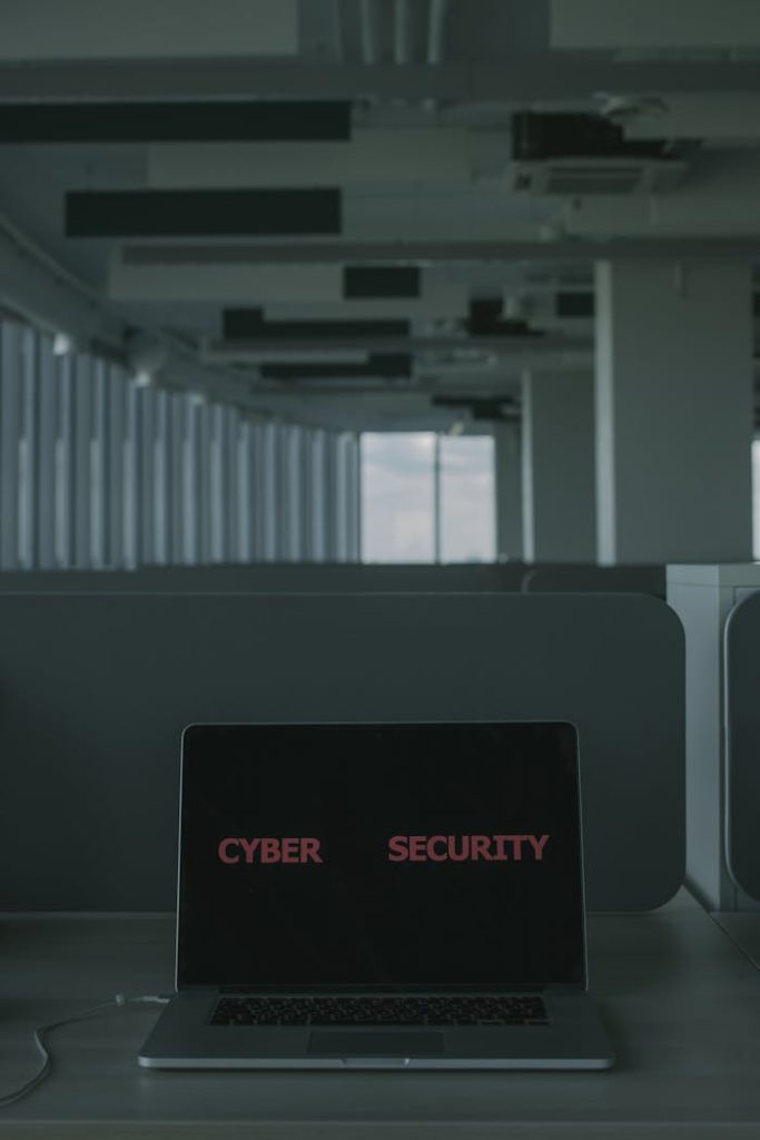 pexels photo 5483240 Laptop displaying 'Cyber Security' in a modern office setting, emphasizing tech and cybersecurity themes.